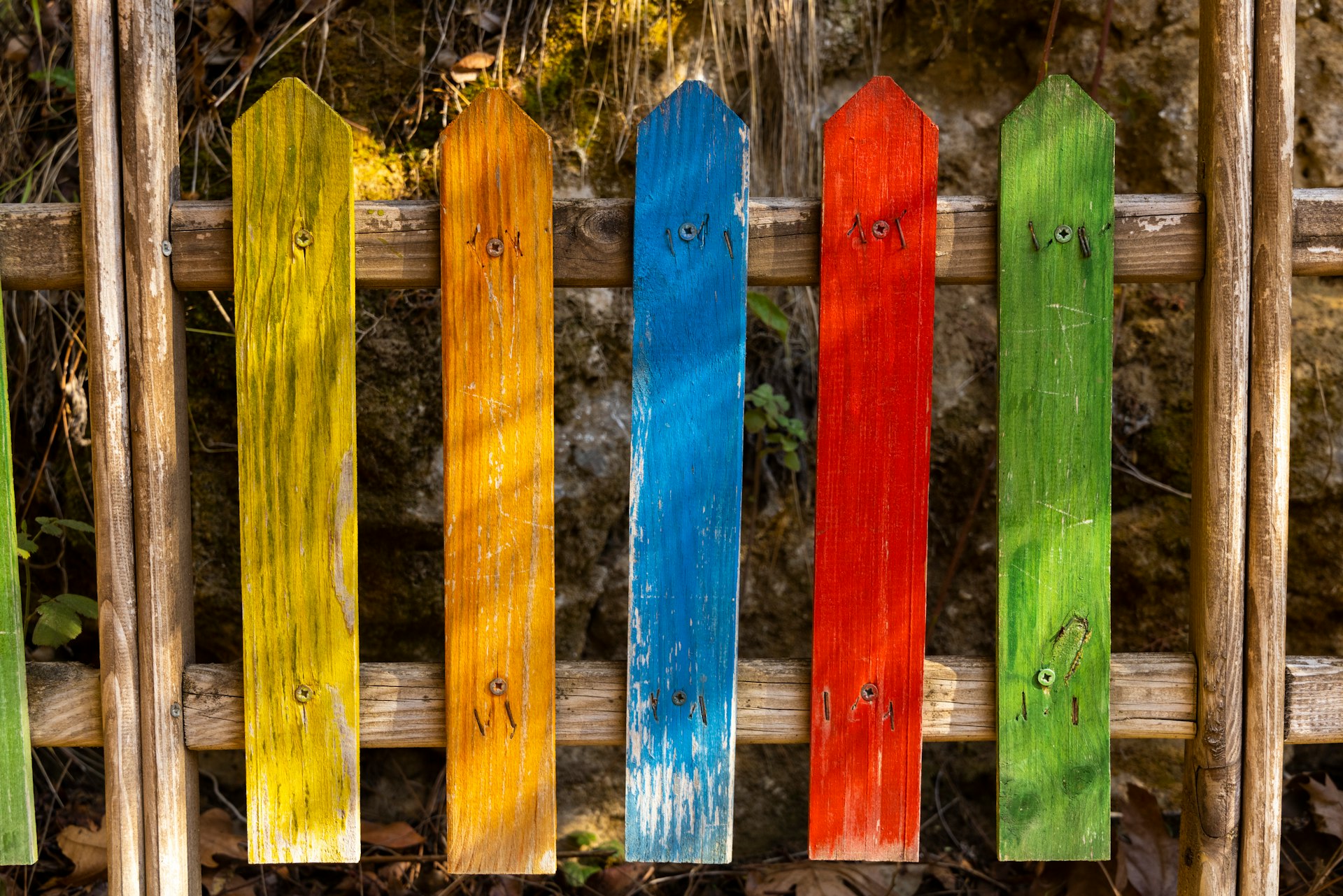 blue and yellow wooden fence